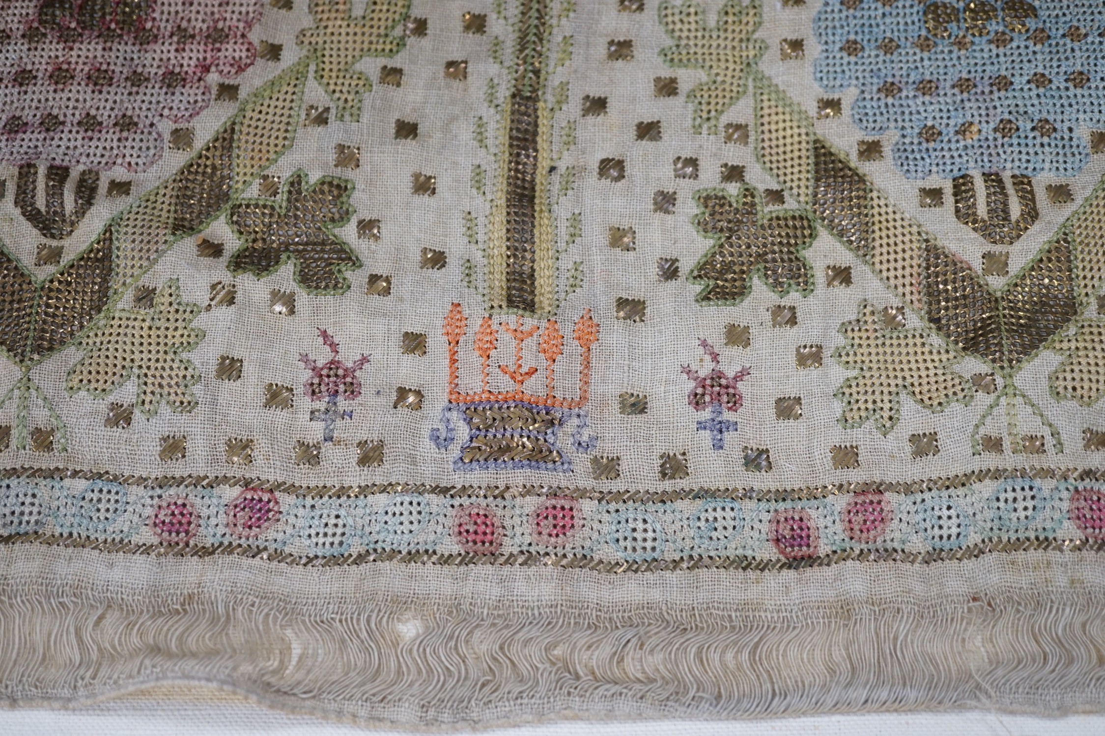 Two 19th century embroidered Turkish towel ends, one framed, 46cms wide x 30cms high